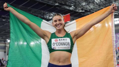 Irish athlete Kate O'Connor celebrates after winning World Indoor pentathlon silver in the Chinese city of Nanjing