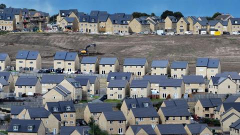 An aerial view of a recently built development of mixed priced homes in Bradford, England