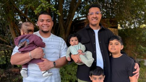 Naeem (left) and Shuaeb (right) with their children