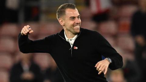 Southampton interim manager Tonda Eckert punches the air in celebration