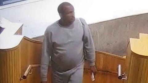 Handout grab from CCTV issued by the Metropolitan Police of Hadush Gerberslasie Kebatu (left) in Dalston on October 24, 2025.