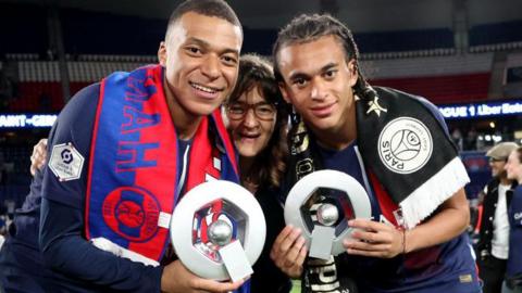 Kylian Mbappe and his brother Ethan along with their mother
