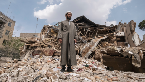 An Iranian man walks among the ruins of a synagogue in Tehran, Iran, on April 20, 2026.