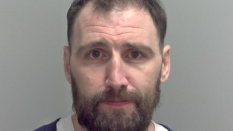 Police custody image of Adam Barnard