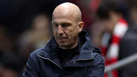 Gehard Struber with his eyes closed on the touchline