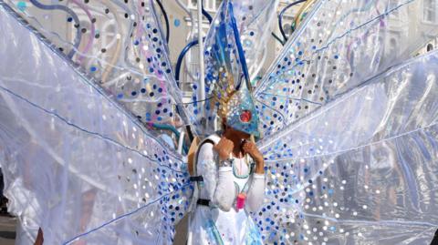 A carnival performer dressed up