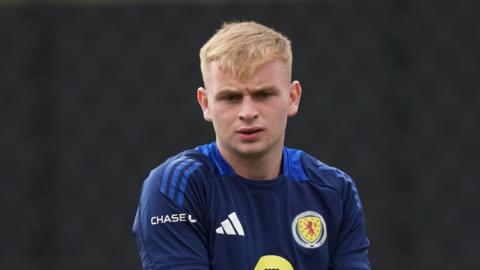 Rory Mahady wearing a Scotland goalkeeper's training top