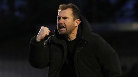 Paul Wotton celebrates winning at Enfield Town