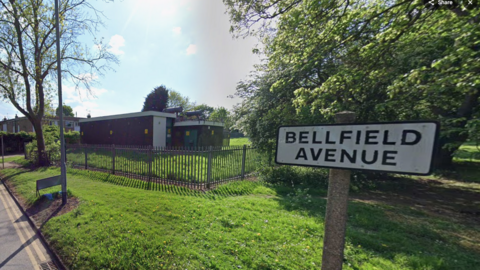 A road sign reading "Bellfield Avenue".
