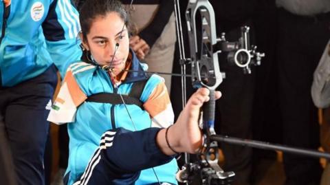 Para Asian gold medallist and world's first armless champion archer Sheetal Devi with coach Abhilasha Chaudhary during the launch of a book cover on December 1, 2023 in New Delhi, India.