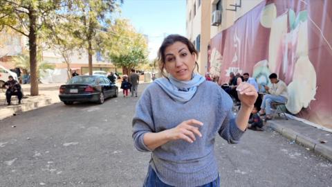Carine Torbey in grey jumper and blue scarf