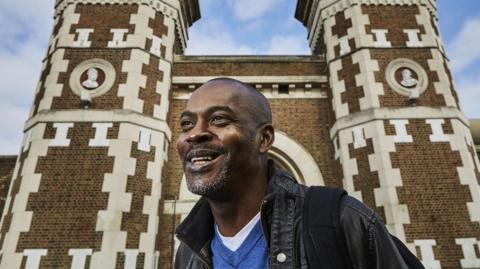 Profile of Stephen Akpabio-Klementowski in front of a prison building