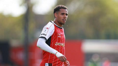 Ethan Erhahon on the pitch during a match for Lincoln City