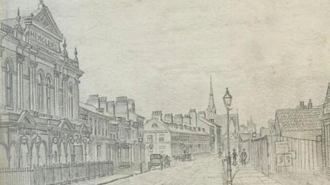 A pencil sketch of Hull's Anlaby Road showing a large building in the foreground and a row of terrace house in the background. Two horse and carriages are on the road and a number of people are walking along the pavement