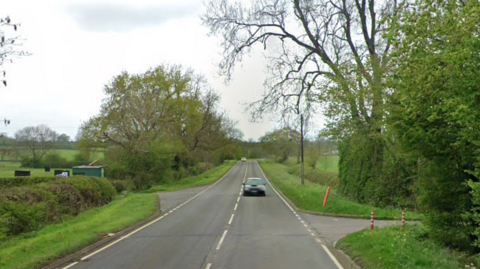 The entrance to a farm on a rural road