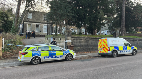 Police cars outside property on Norwich Road