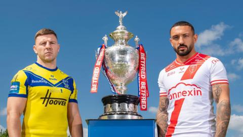 Warrington's George Williams with Hull KR's Elliot Minchella and the Challenge Cup trophy