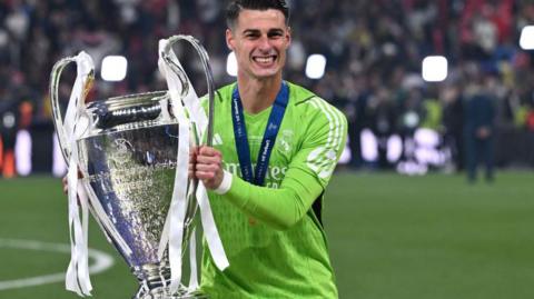 Kepa Arrizabalaga with the Champions League trophy which he won while on loan at Real Madrid last season.