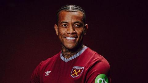 Igor Julio wearing a West Ham shirt
