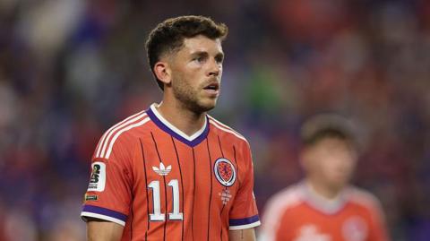Ryan Christie looks on for Scotland