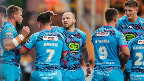 Wigan celebrate a Liam Marshall try against Castleford