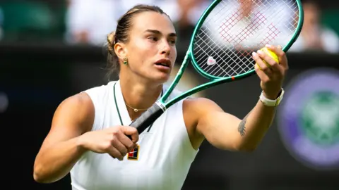 Aryna Sabalenka prepares to serve