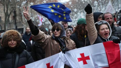 Supporters of the Georgian opposition take part in a protest action in Tbilisi on 28 December 2024.