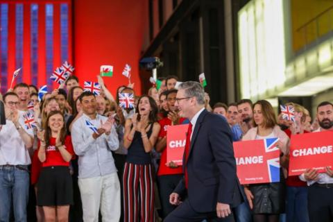 Starmer walks past cheering supporters