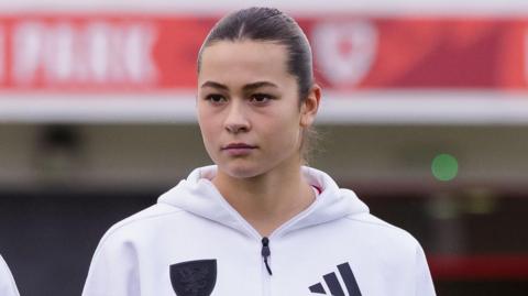 Scarlett Hill in Wales training top