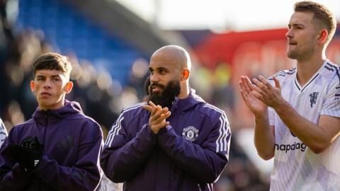 Manchester United youngster Shea Lacey (left) applauds fans after Sunday's win at Crystal Palace