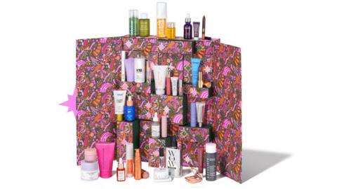 Space NK advent calendar showing a pink print box and various miniature beauty products