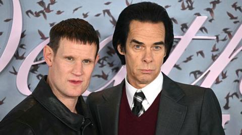 British actor Matt Smith (L) and Australian musician and author Nick Cave (R) pose on the red carpet upon arrival to attend the world premiere of TV series The Death of Bunny Munro, based on a novel by Nick Cave of the same name, at the Royal Festival Hall in London on October 30, 2025.