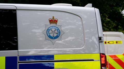 A police van with a North Yorkshire Police logo on the door 
