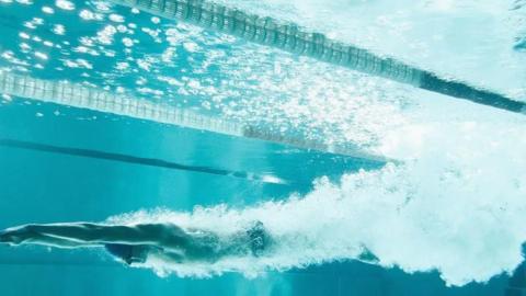 A person swimming underwater