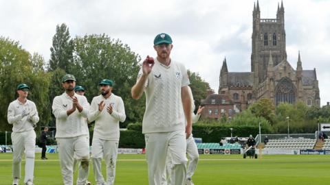 Tom Taylor leaves the field at Worcester after his career-best 6-28 against Warwickshire