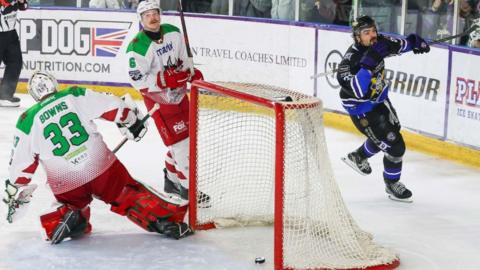 Storm's Brandon Cutler celebrates behind the net as the puck goes beyond Cardiff netminder Ben Bowns for the goal winning game