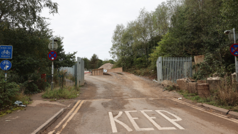 Metal gates and fencing at the entrance to a quarry