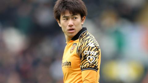 Yu Hirakawa looks back over his shoulder during a game for Hull City