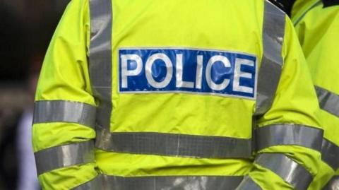 stock image of hi-vis coat of a police officer