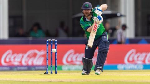 Paul Stirling plays the ball away with the bat