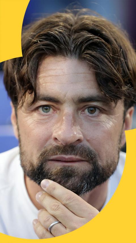 Leicester manager, Russell Martin, looks directly into camera.