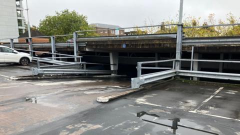 Image of a car park barrier inside the car park. It's on the upper level.