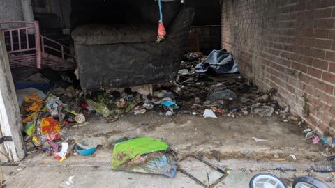 An image of the garage where the dogs were found. There is litter and faeces over the floor