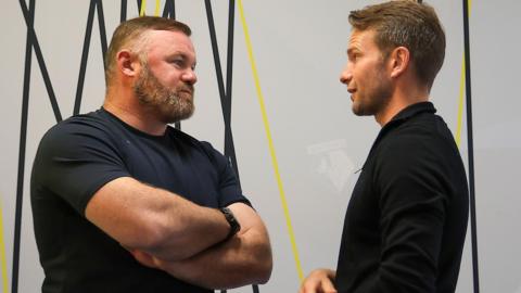 Wayne Rooney (left) talks to Tom Cleverley
