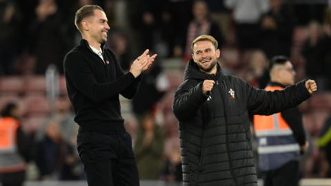 Tonda Eckert (left) and Leo Scienza (right) celebrate after winning a game