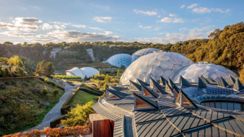 A view of the biodomes at the Eden Project in St Austell, Cornwall. It is a sunny day.