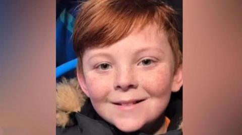 Tommie-lee Gracie Billington smiling wearing a coat