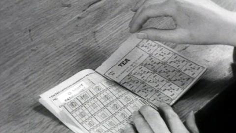 A rationing book opened to a page for tea rations.