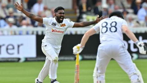 Asitha Fernando celebrates taking a wicket for Sri Lanka 