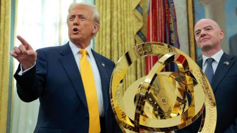 US president Donald Trump with Fifa president Gianni Infantino beside the Fifa Club World Cup trophy